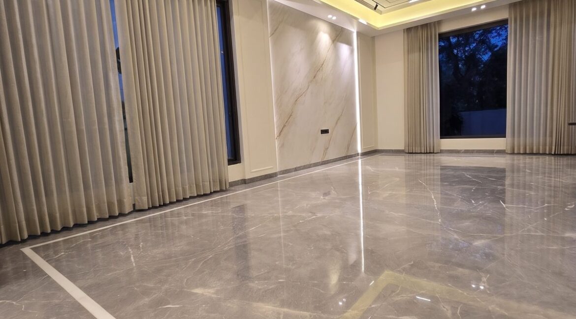 Windchimes Construction Bare Living Room Glossy Marble At Night - Rajesh Kumar