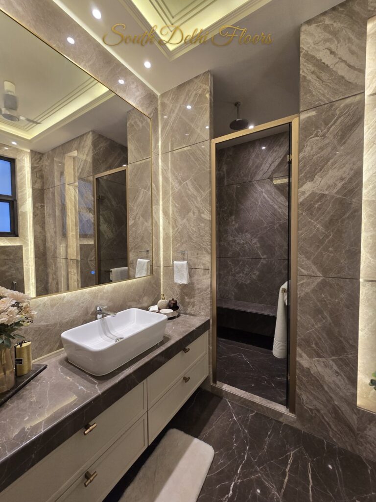 Bathroom taupe marble vanity at a Windchimes Construction builder floor in South Delhi