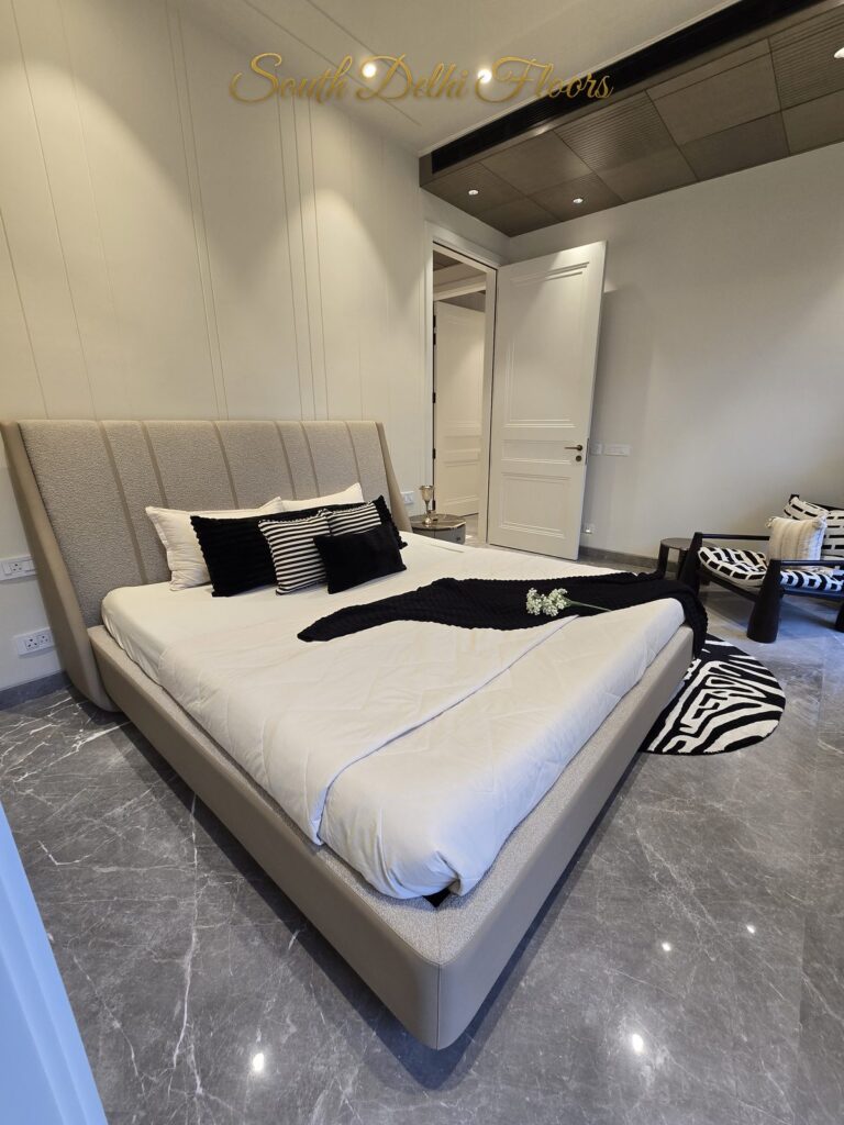 Bedroom bed accent chair, South Delhi builder floor by Windchimes, photographed by SouthDelhiFloors