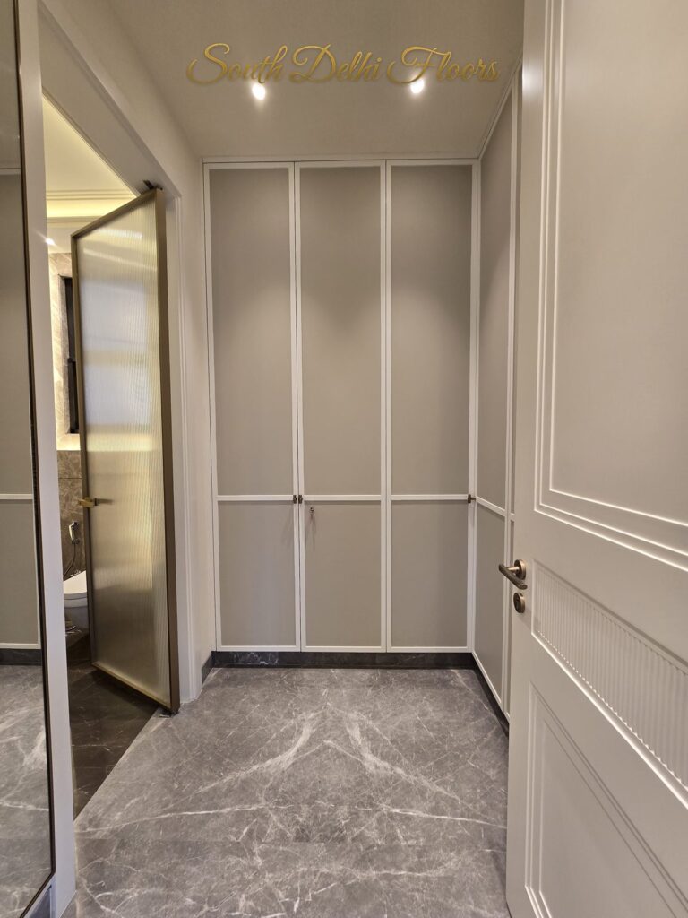 Dressing room wardrobe doors at a Windchimes Construction builder floor in South Delhi
