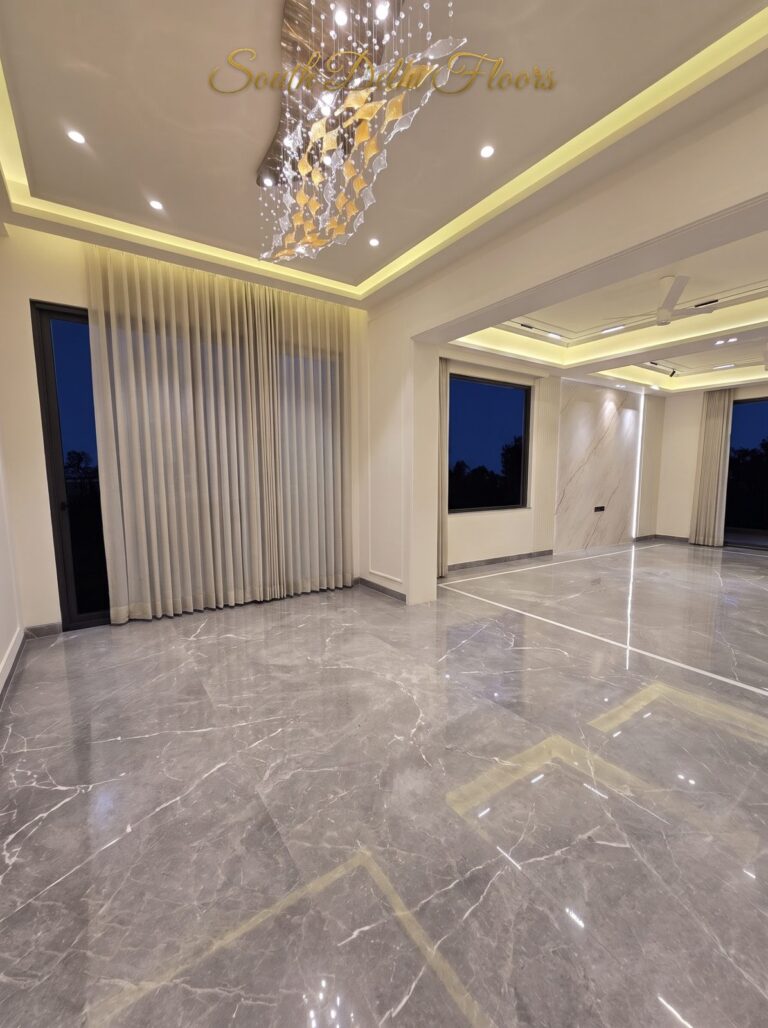 Dining hall crystal chandelier at night at a Windchimes Construction builder floor in South Delhi