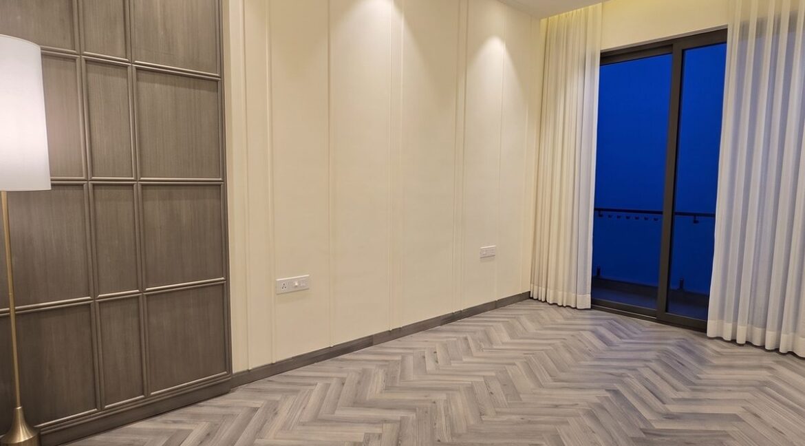 Windchimes Construction Empty Guest Bedroom Herringbone Floor At Night - Builder