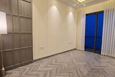 Windchimes Construction Empty Guest Bedroom Herringbone Floor At Night - Builder