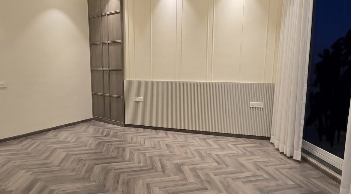 Windchimes Construction Empty Guest Bedroom Panelled Wall At Night - Rajesh Kumar