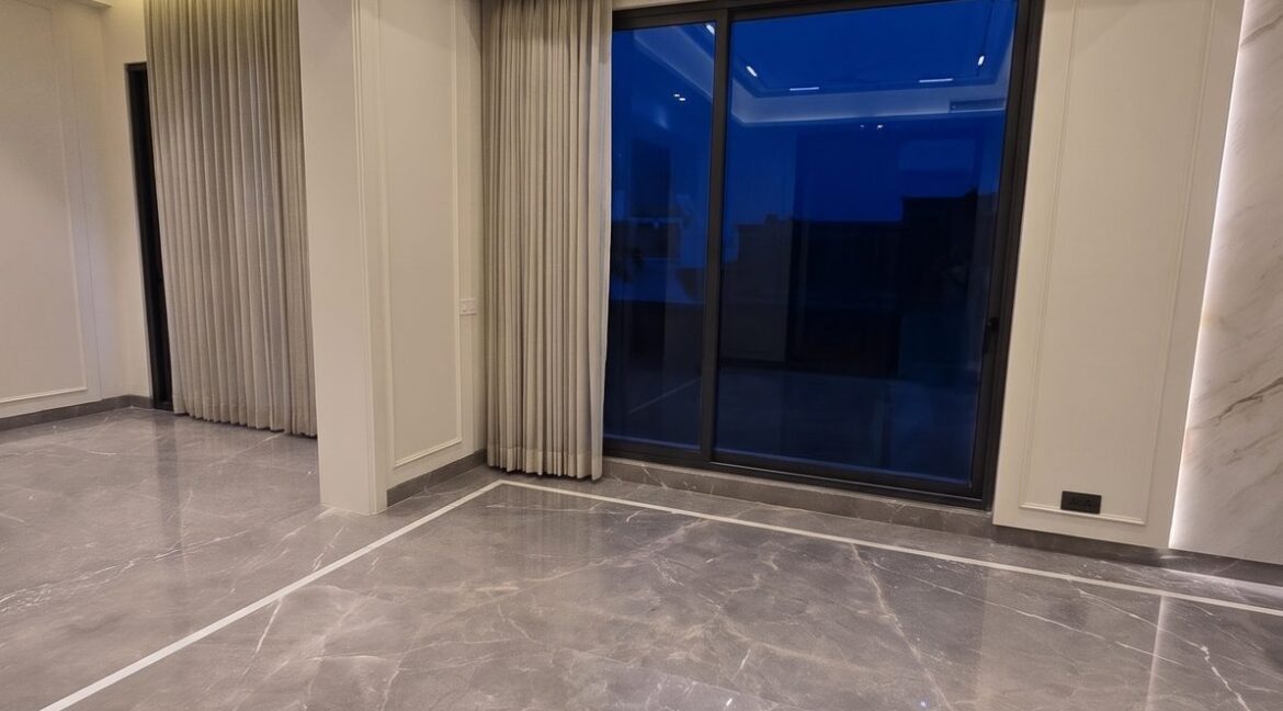 Windchimes Construction Empty Lounge Window Wall At Night - Surbhi Nandrajog