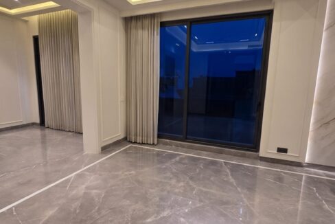 Windchimes Construction Empty Lounge Window Wall At Night - Surbhi Nandrajog