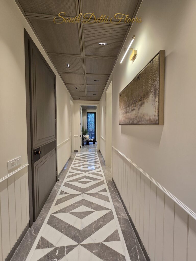 Hallway wood ceiling artwork at a Windchimes Construction builder floor in South Delhi