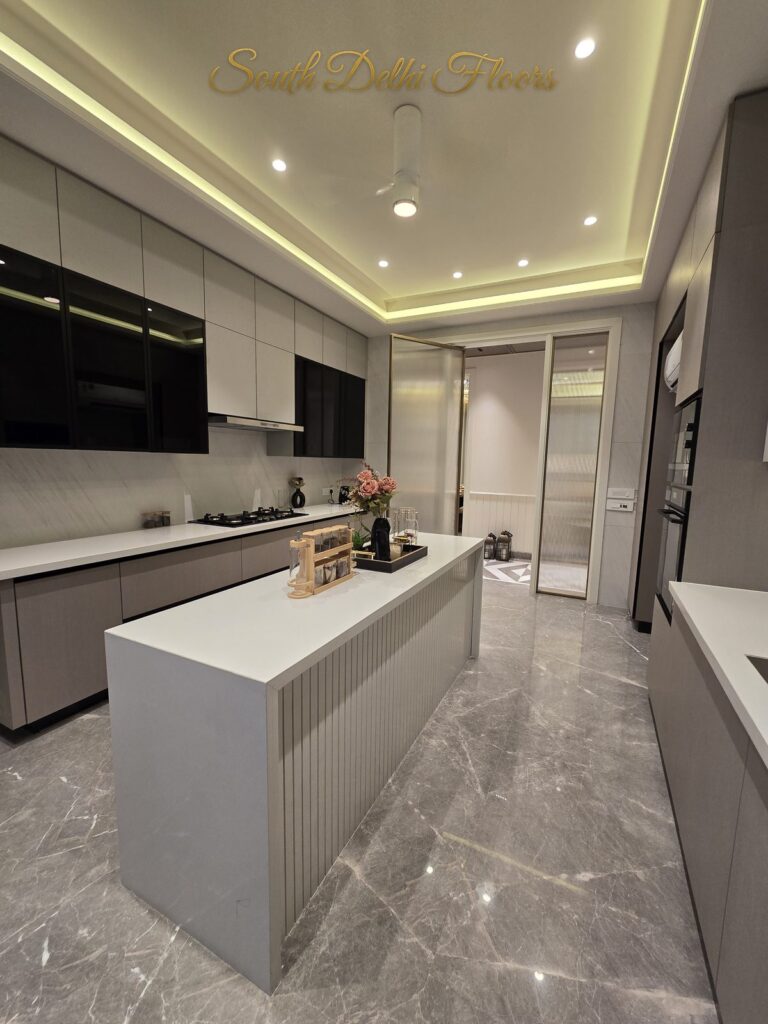 Kitchen fluted island at a Windchimes Construction builder floor in South Delhi