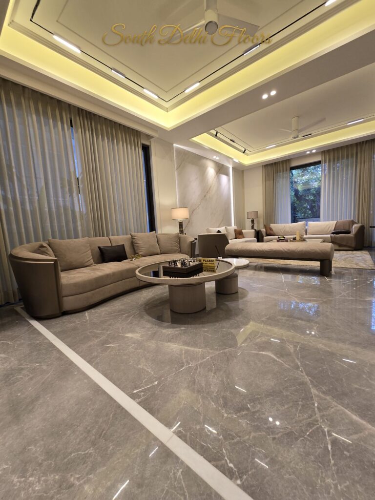 Living room L shaped sofa at a Windchimes Construction builder floor in South Delhi