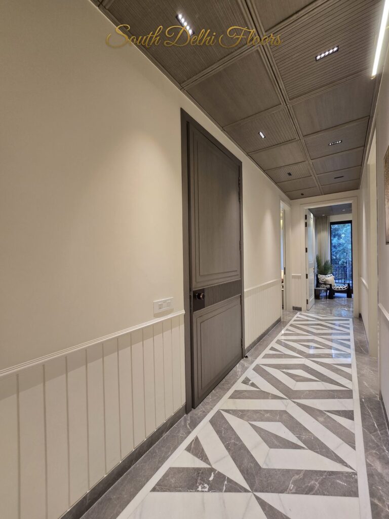Lobby corridor grey door at a Windchimes Construction builder floor in South Delhi