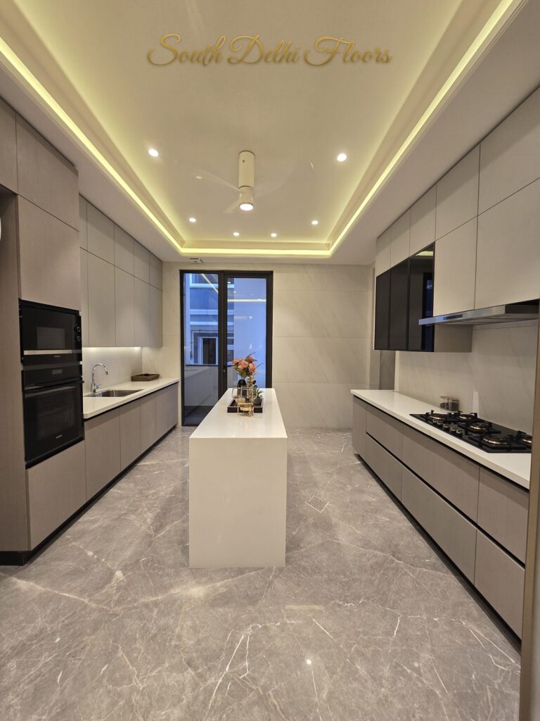 Modular kitchen island at a Windchimes Construction builder floor in South Delhi