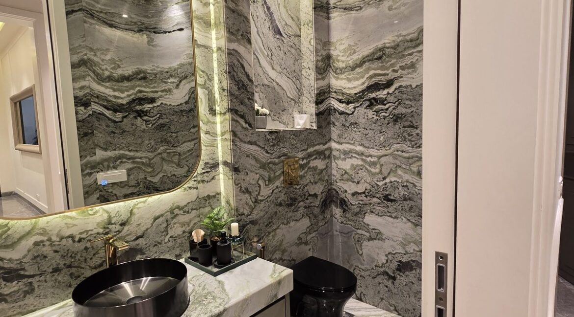 Windchimes Construction Powder Room Green Marble - Rajesh Kumar