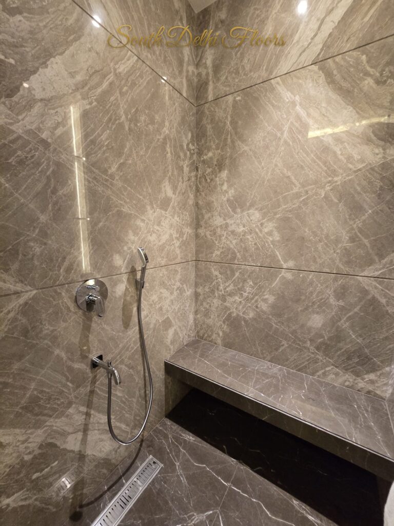Shower marble bench at a Windchimes Construction builder floor in South Delhi