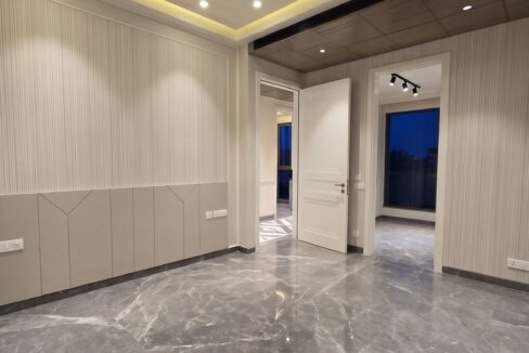 Windchimes Construction Unfurnished Bedroom Fluted Panelling At Night - Surbhi Nandrajog