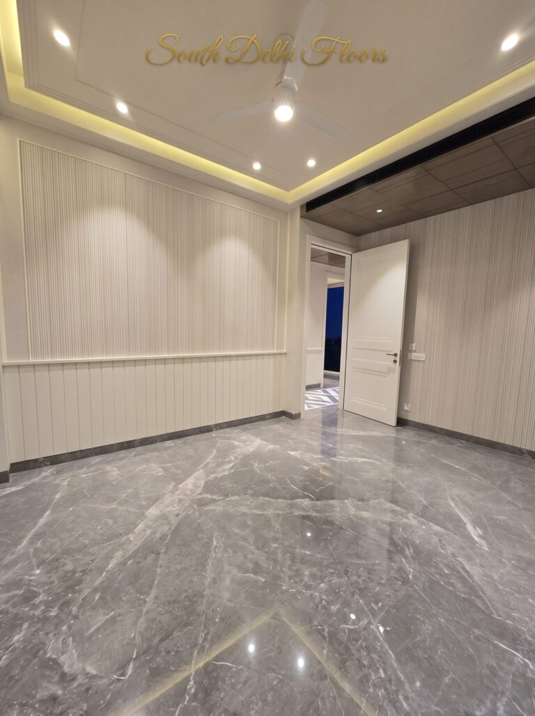 Bedroom fluted wall at night at a Windchimes Construction builder floor in South Delhi