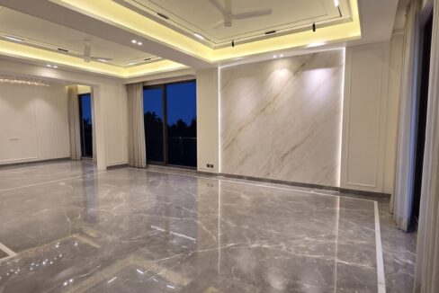 Windchimes Construction Unfurnished Living Hall Wide At Night - Amrit Lal