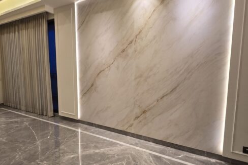 Windchimes Construction Unfurnished Living Room Backlit Marble Wall At Night - Rajesh Kumar