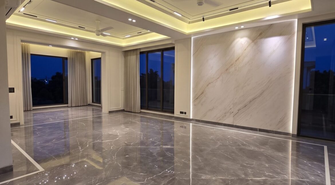 Windchimes Construction Unfurnished Living Room Cove Lighting At Night - Amrit Lal