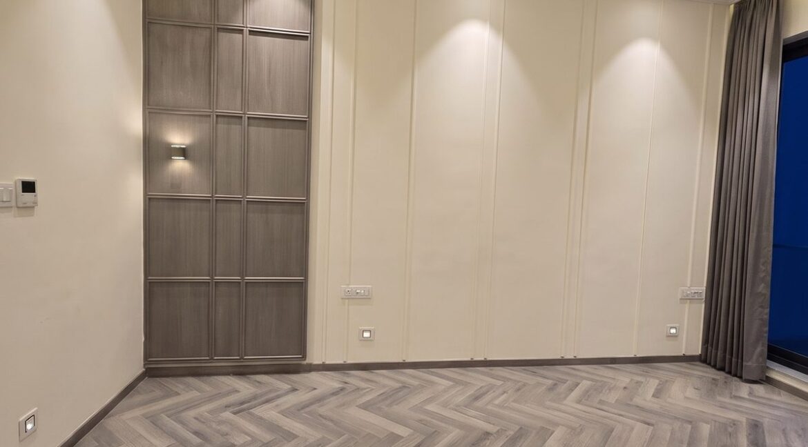 Windchimes Construction Vacant Bedroom Herringbone Wood Floor At Night - Builder