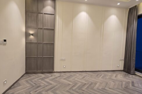 Windchimes Construction Vacant Bedroom Herringbone Wood Floor At Night - Builder