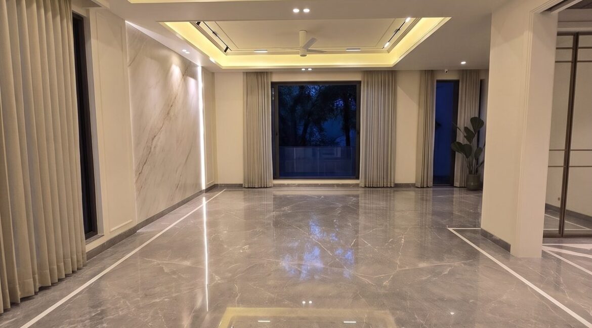 Windchimes Construction Vacant Formal Living Room At Night - Amrit Lal