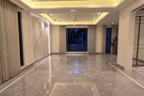 Windchimes Construction Vacant Formal Living Room At Night - Amrit Lal