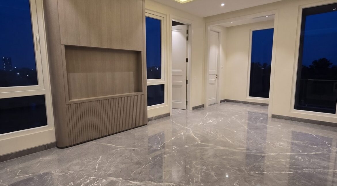Windchimes Construction Vacant Master Bedroom TV Wall At Night - Amrit Lal