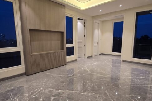 Windchimes Construction Vacant Master Bedroom TV Wall At Night - Amrit Lal