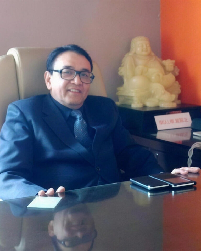 Amrit Lal Giroti, Director of Windchimes Constructions Private Limited, at his desk in the Vasant Vihar office